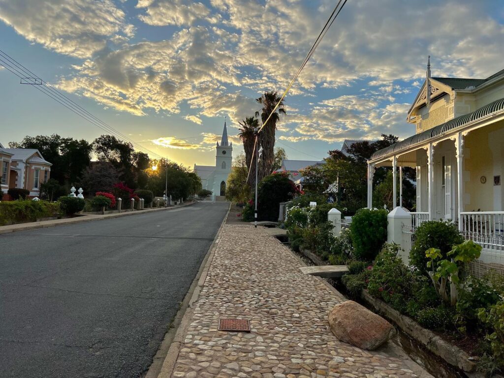 A street scene in Prince Albert with the Dutch reformed Church in view.